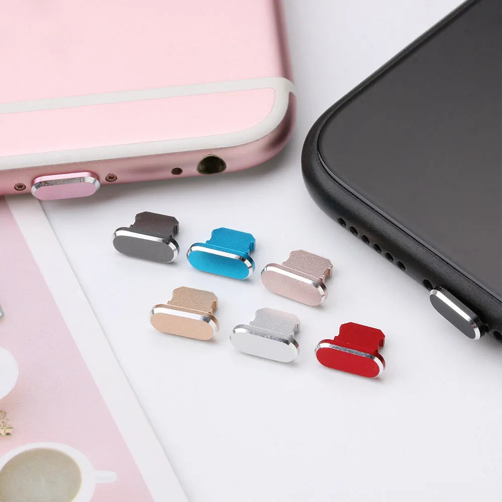 Aluminium alloy charging port dust plug for iPhone in various colours including gold, black, and rose gold.