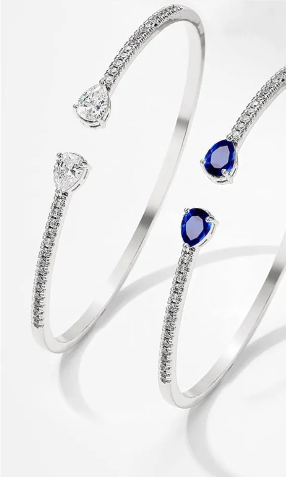 Copper personalised bracelet with multi-zircon inlay detail in white or blue colour