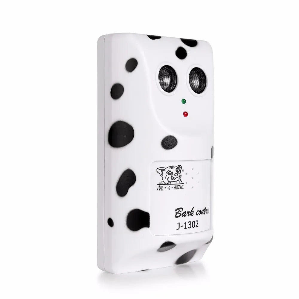 White anti-barking ultrasonic dog repeller mounted on a wall with rotary holder, 7x13x5cm