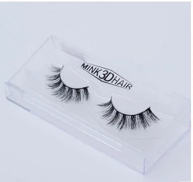 Pair of faux mink eyelashes with long tail and cotton stem against white background
