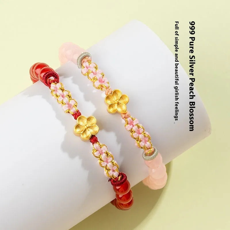 Hand-woven red rope bracelet with diamond-shaped crystal peach blossom elements in Chinese style