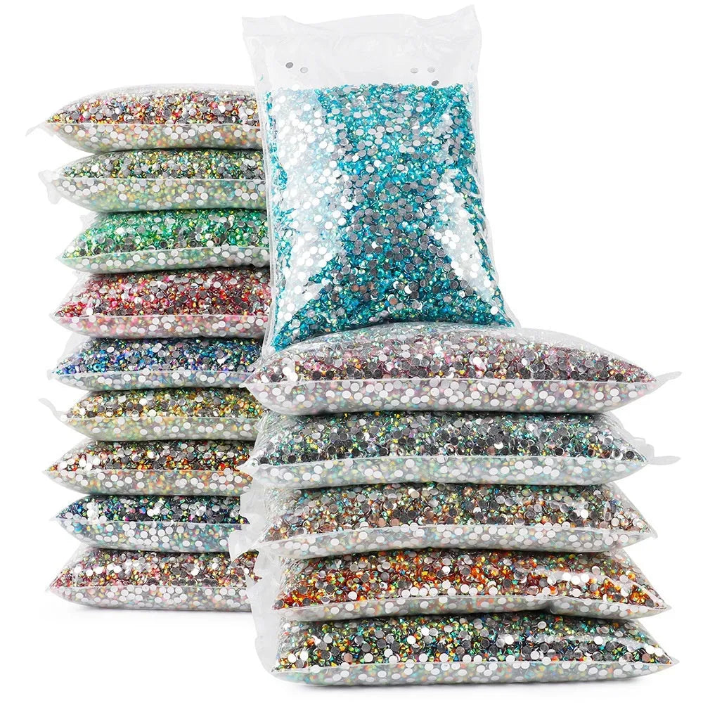 Plastic resin nail art rhinestones in multiple colours with electroplated surfaces arranged in mesh packaging