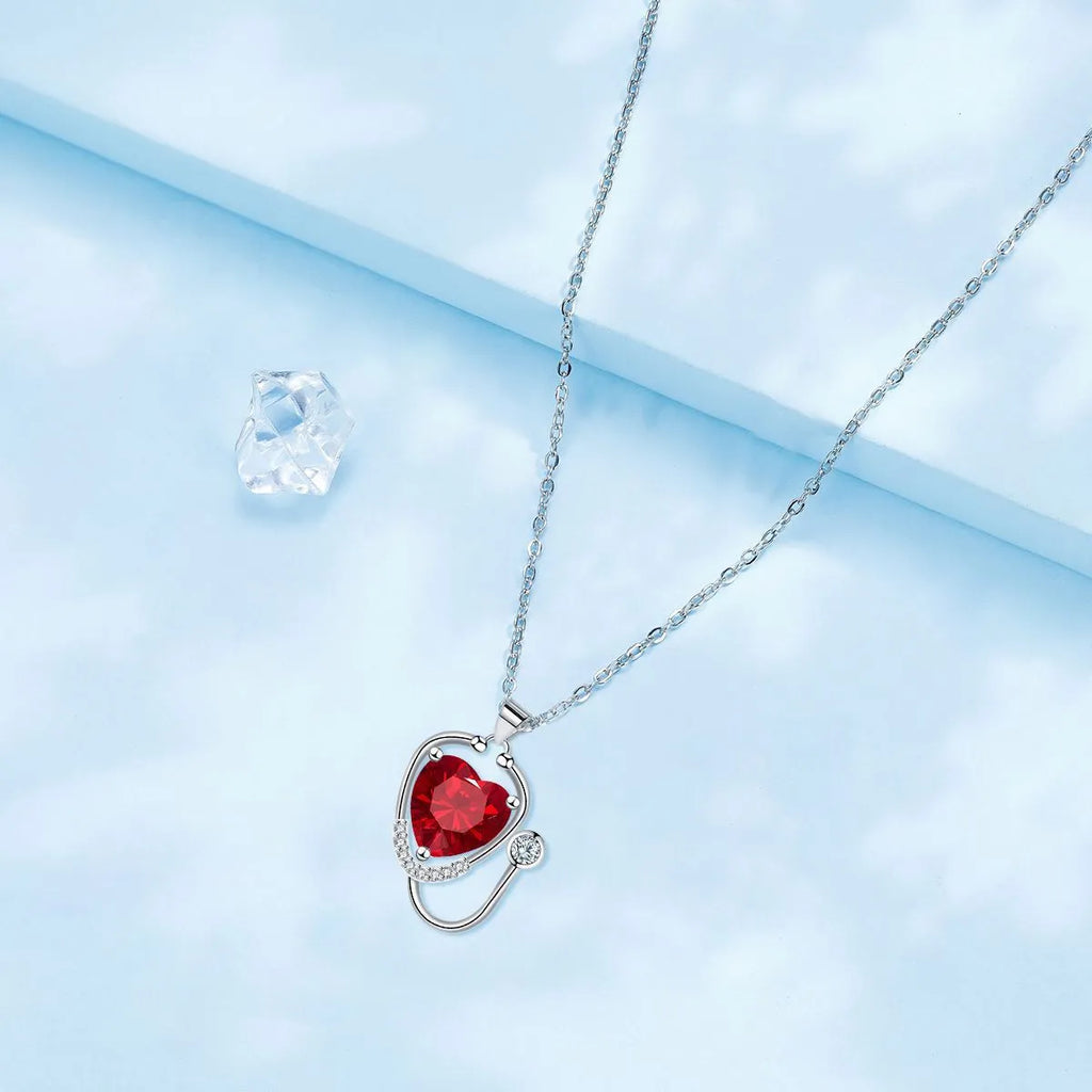 Women's stethoscope wing pendant necklace in red diamond colour with copper construction
