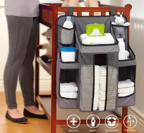 Gray baby diaper organizer hanging on crib with adjustable Velcro straps, TC Oxford cloth construction