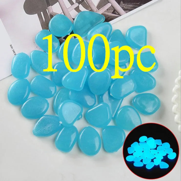 Luminous fluorescent aquarium and garden pebbles in mixed colours including dark purple, yellow, light blue, pink, orange