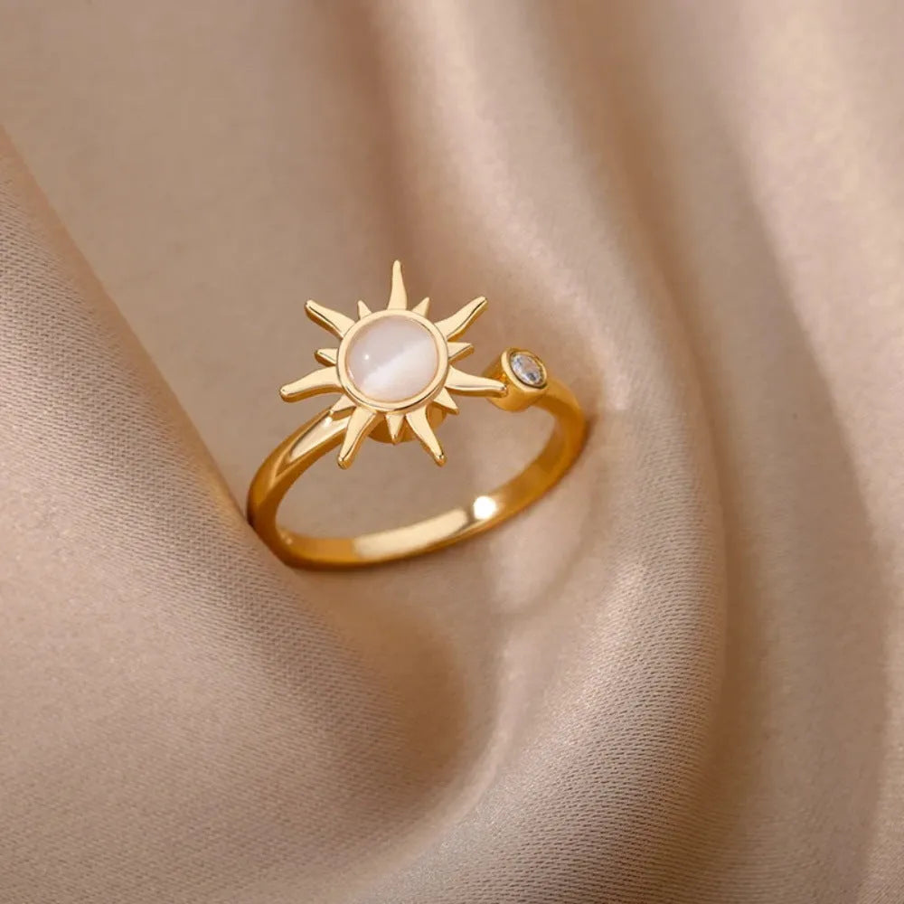 Adjustable copper decompression ring with rotatable element in gold or platinum finish