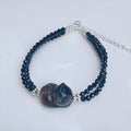 Hand-carved obsidian climbing cat bracelet in natural icy K2 obsidian with Korean-style design for women