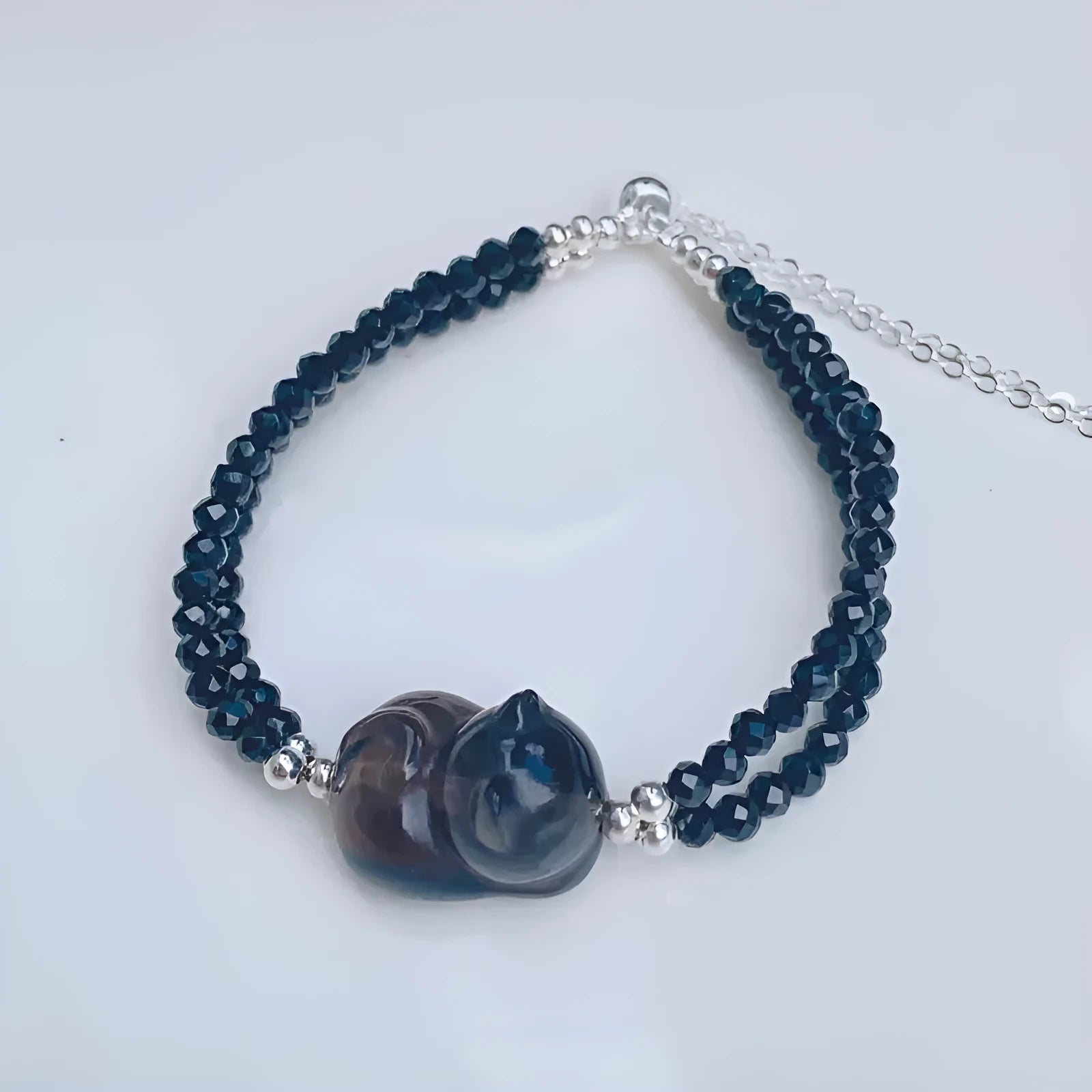 Hand-carved obsidian climbing cat bracelet in natural icy K2 obsidian with Korean-style design for women