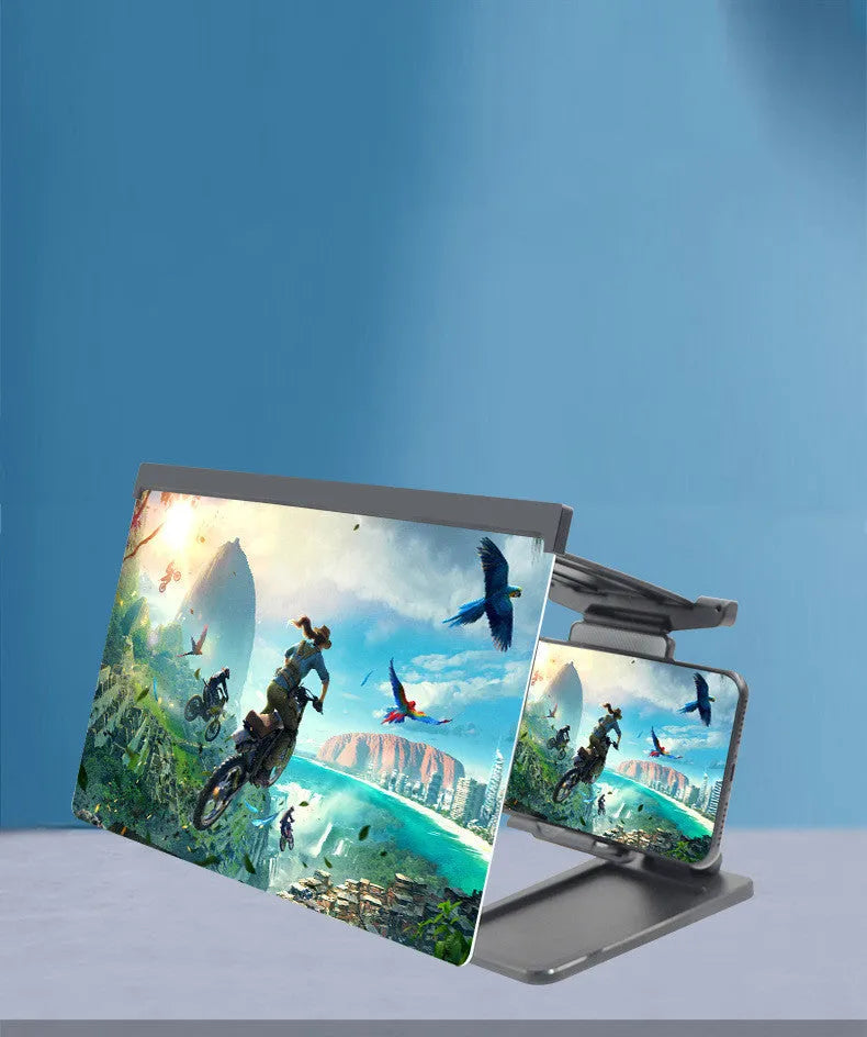 Black foldable mobile phone screen amplifier with detachable holder on a desk