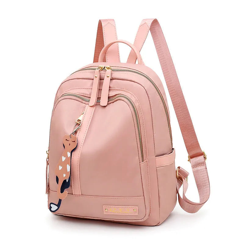 Black nylon casual backpack with square vertical shape, soft handle, and three-dimensional outer pocket