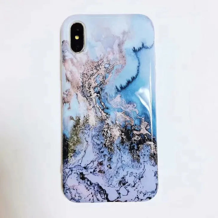 Colourful stone pattern soft back cover case for iPhone on a table.