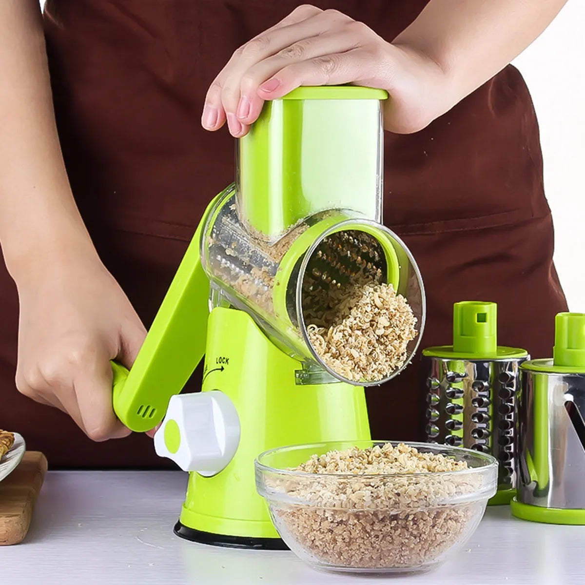 Round mandoline vegetable slicer with three stainless steel blades and suction cup base