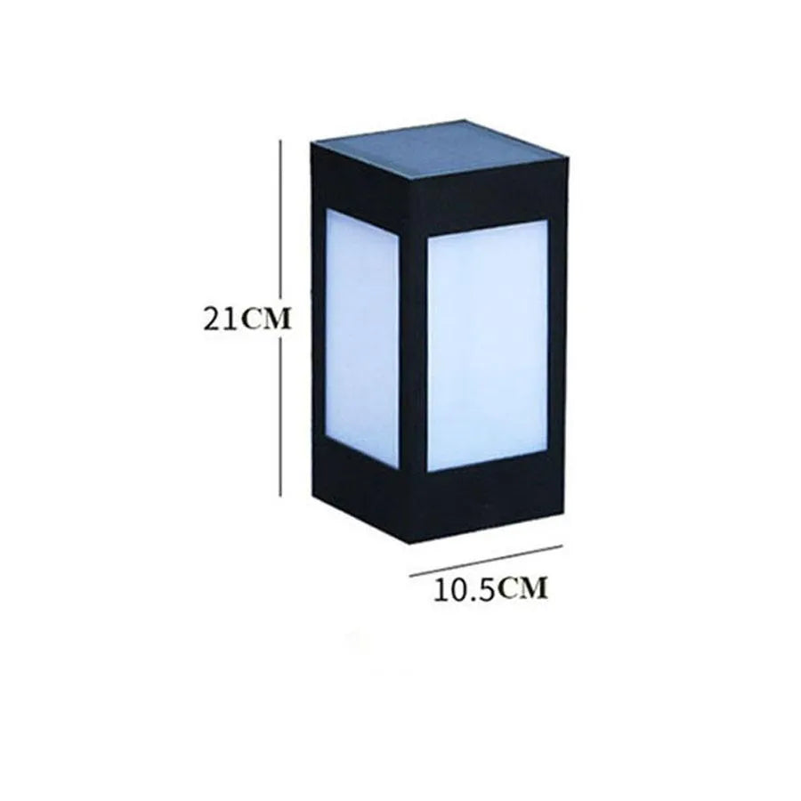 A set of waterproof solar-powered garden lights installed along a lawn edge and wall.