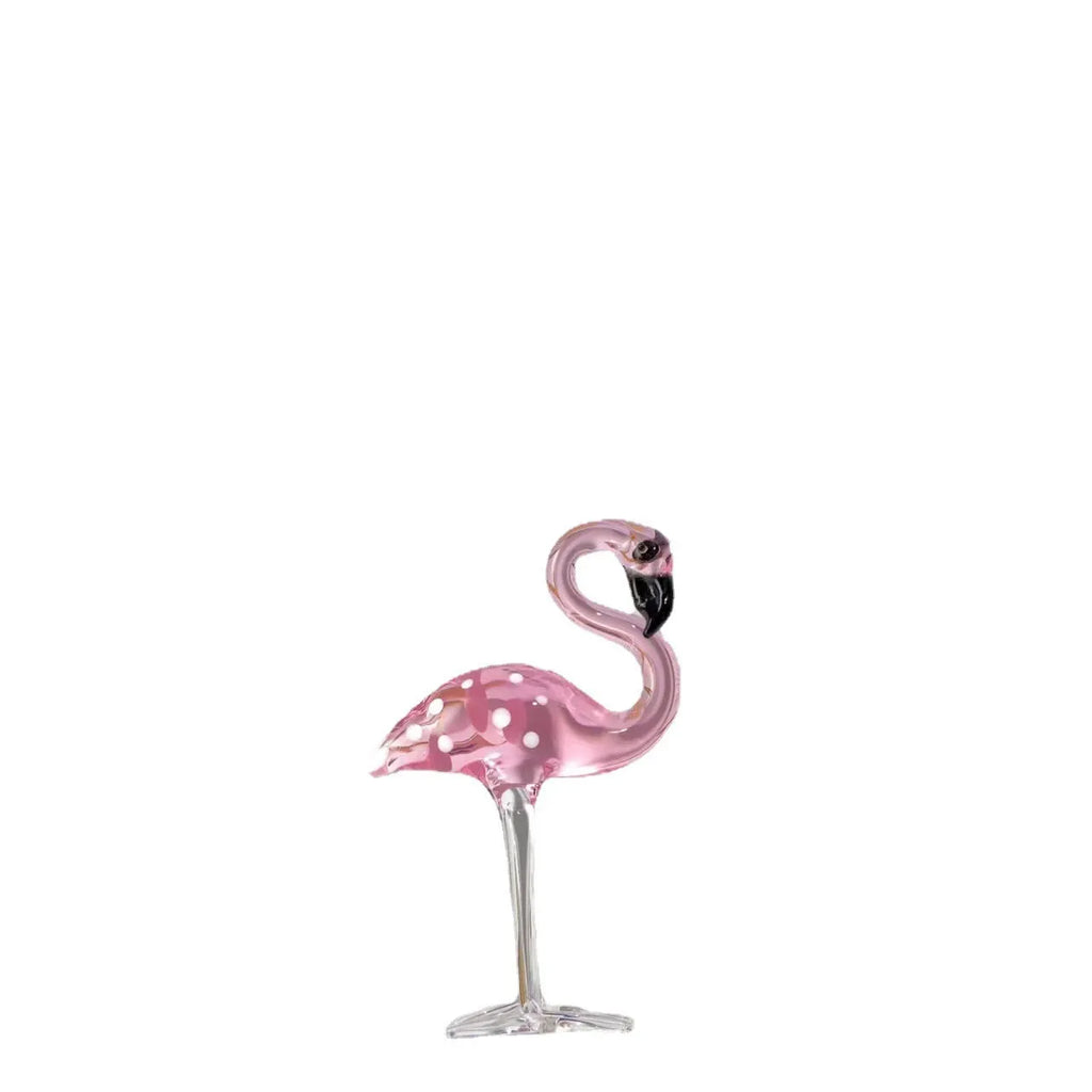 Pink and white crystal flamingo decorative ornament on a table, showing modern simple style.