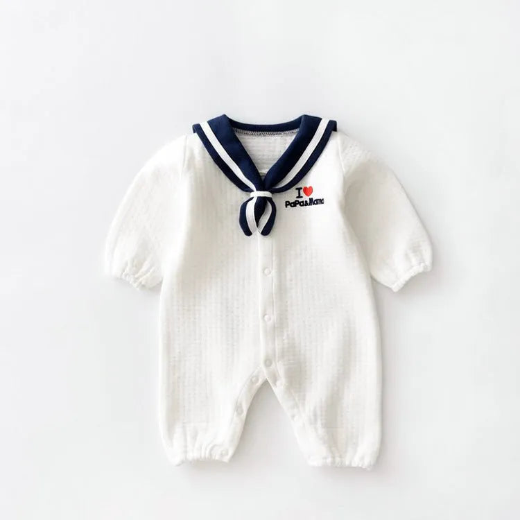 Navy cotton baby onesie with long sleeves and detachable hood on white background