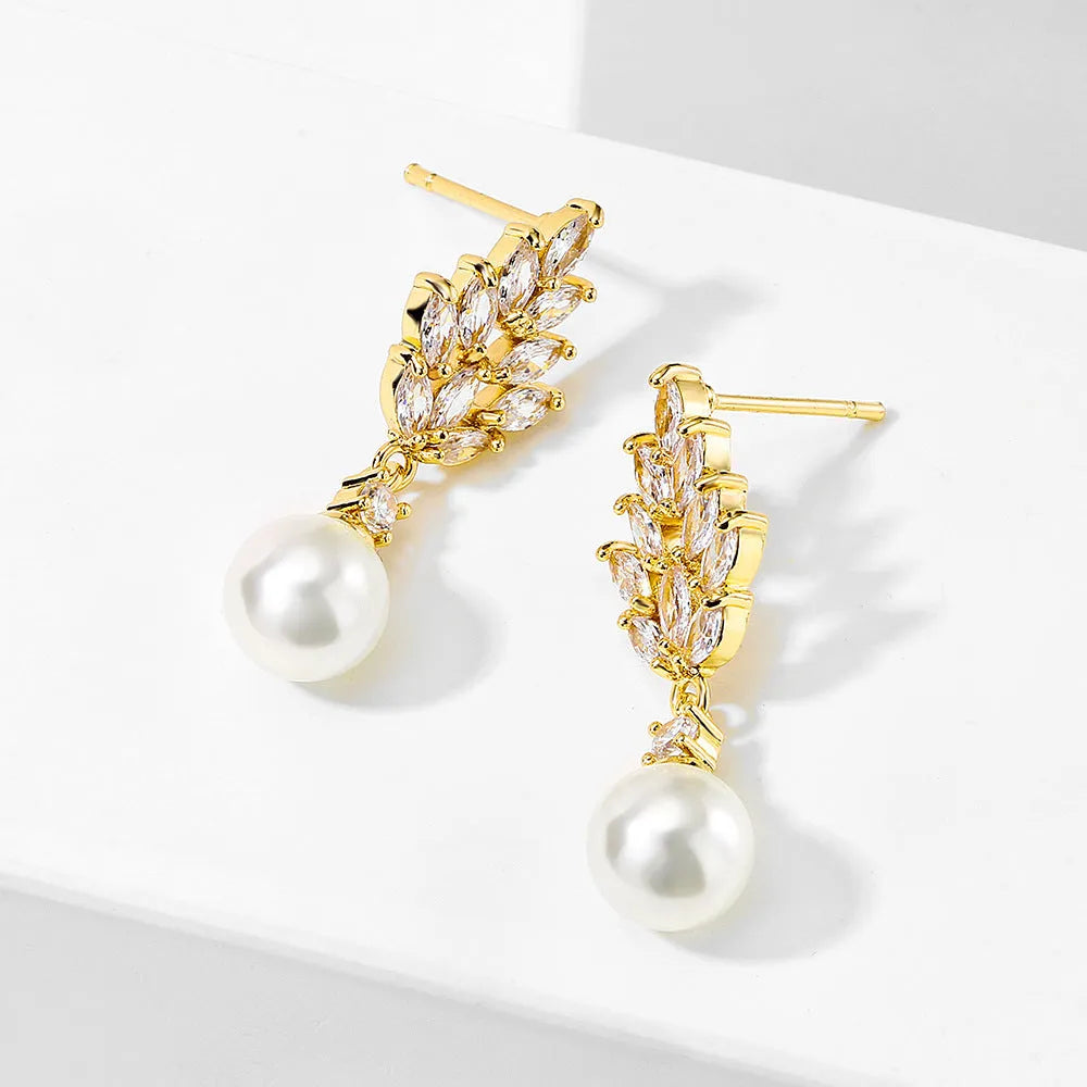 Gold, platinum, and rose gold plated geometric flower earrings with micro-inlaid zircon and pearl details.