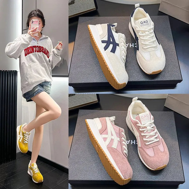 Women's white casual lace-up sneakers with round toe and non-slip sole on a plain background.