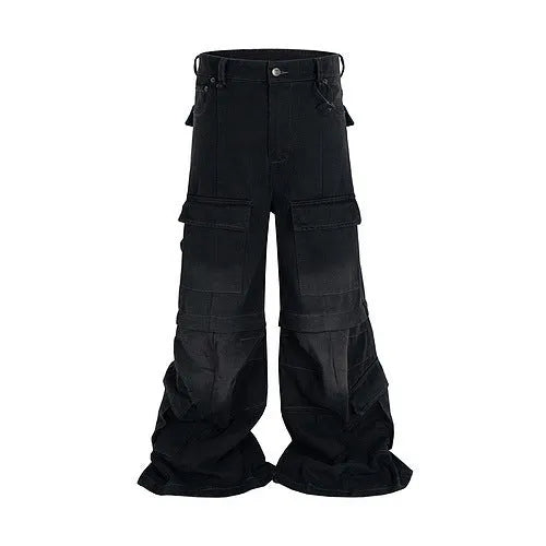 Black washed-out cotton overalls with detachable straps and multiple pockets on a hanger.