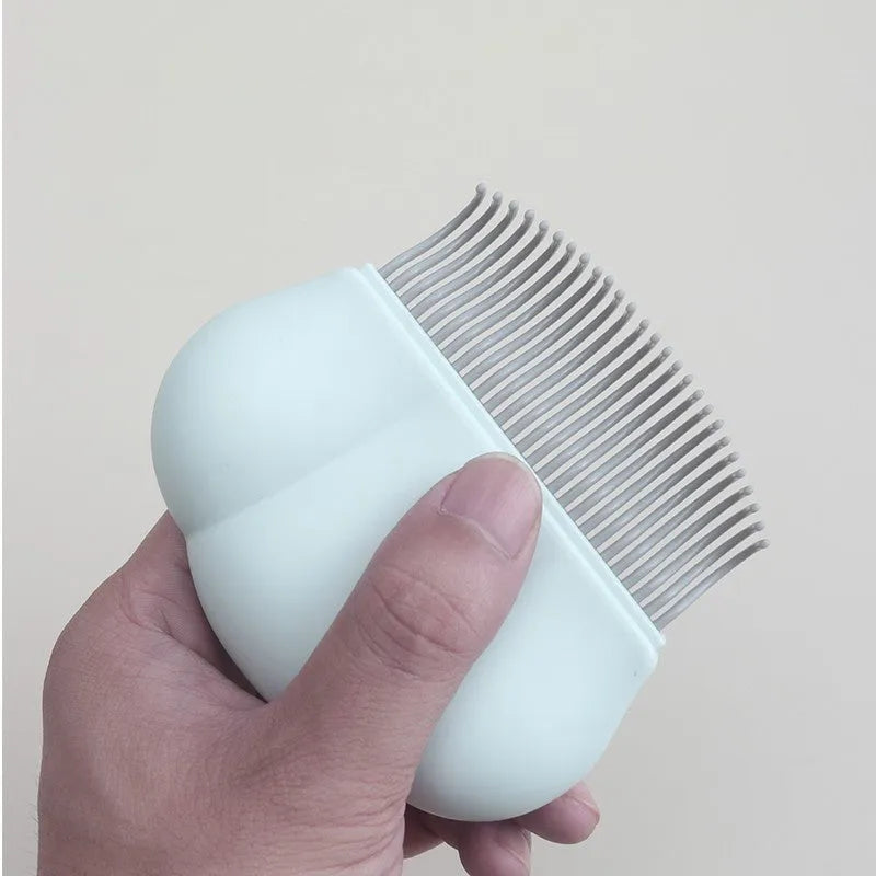 Blue Paw Soft deshedding brush for cats and dogs on a white surface.
