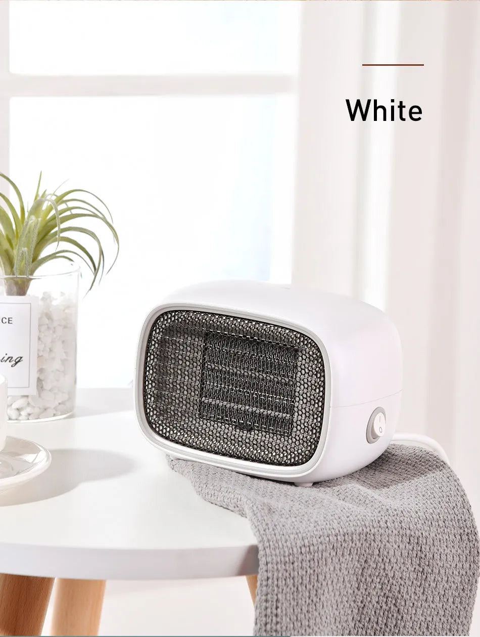 Mini ABS plastic PTC ceramic heater in green colour showing compact dimensions