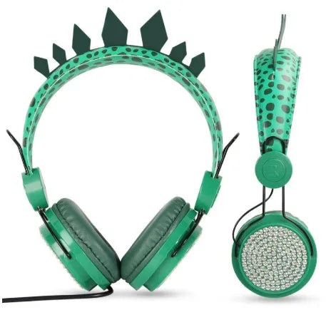 Green dinosaur children's headset with soft earmuffs and 3.5mm plug on a plain background