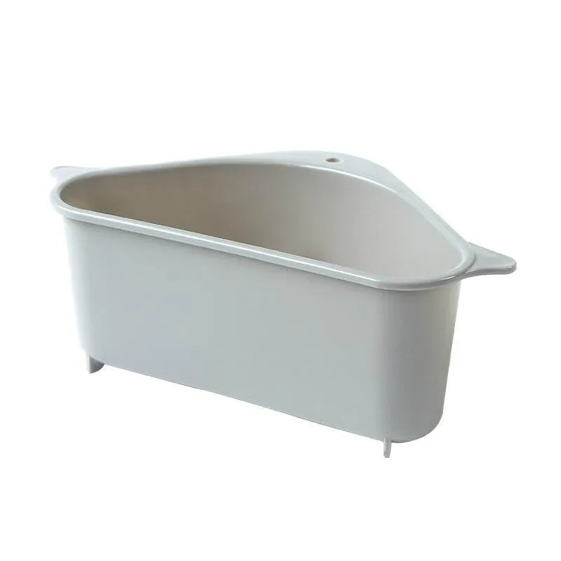 Beige plastic triangle sponge drain rack hanging from a kitchen faucet.