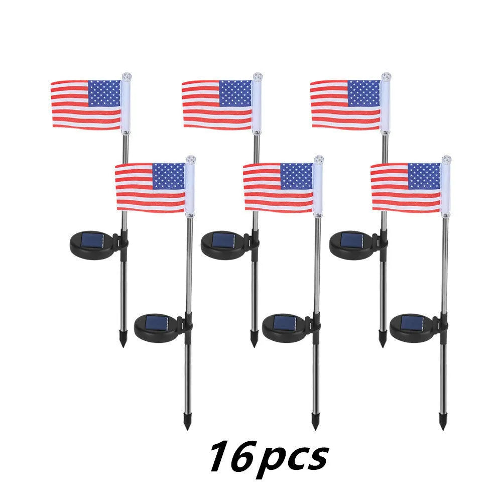Solar-powered stainless steel garden flag light showing American flag design with white LEDs illuminated.