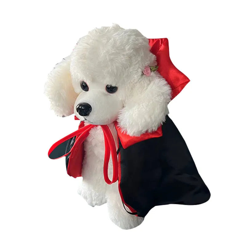 Halloween costume on a pet showing a red bat cloak and pointed devil hat.