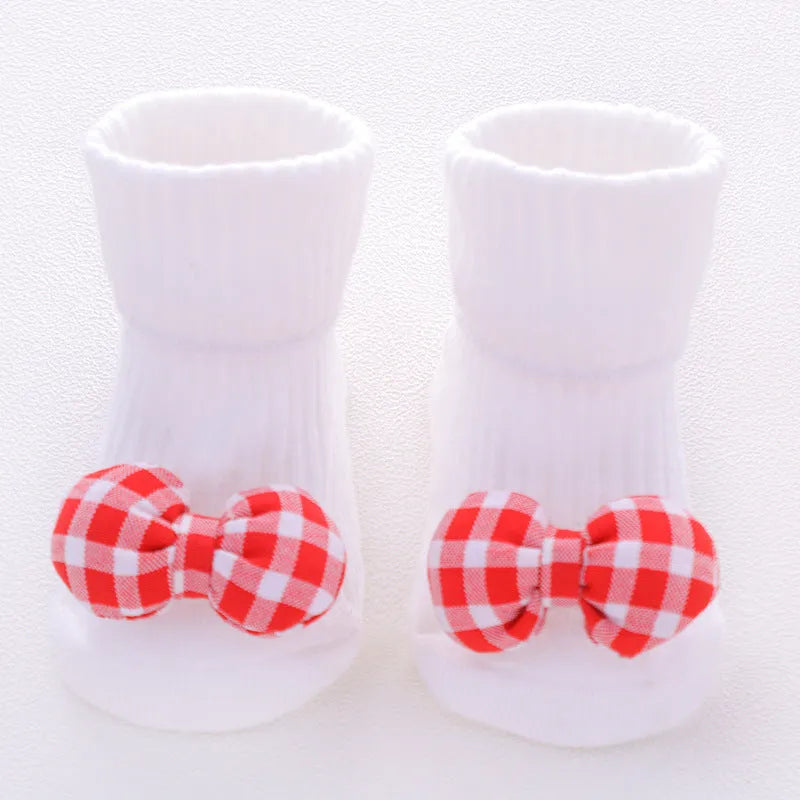 Cotton baby floor socks in multiple designs including panda, bow, and star patterns.