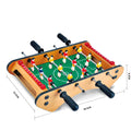 Wooden table football machine with two sets of coloured player figures on a green playing field, ready for two-person play