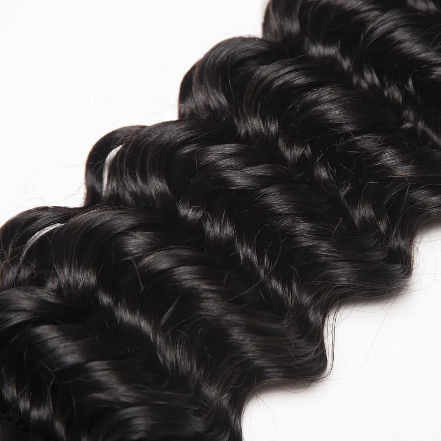 Real hair wig with natural curls in medium long length shown on a mannequin head