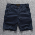 Cotton camouflage work shorts with mid-waist design and zip fly closure
