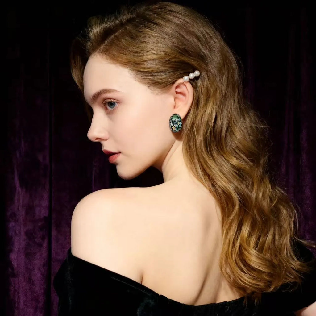 Lacquer rhinoceros skin bead and pearl stud earrings with Chinese character 'Fu' motif in geometric abstract shape, mother-of-pearl colour