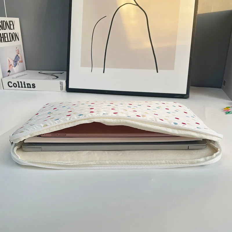 Women's polka dot polyester laptop bag showing front view with storage compartments