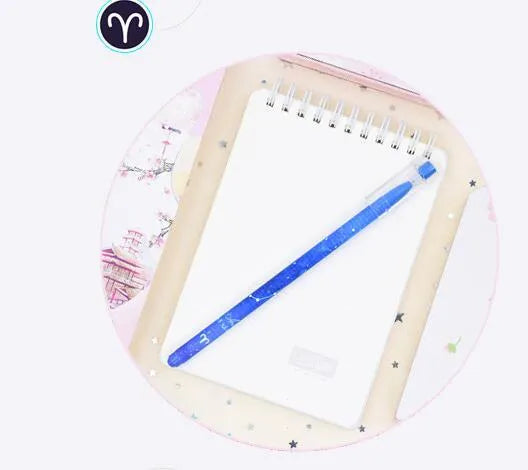 Box of 12 plastic gel pens with quick-drying ink and constellation-themed designs in assorted colours
