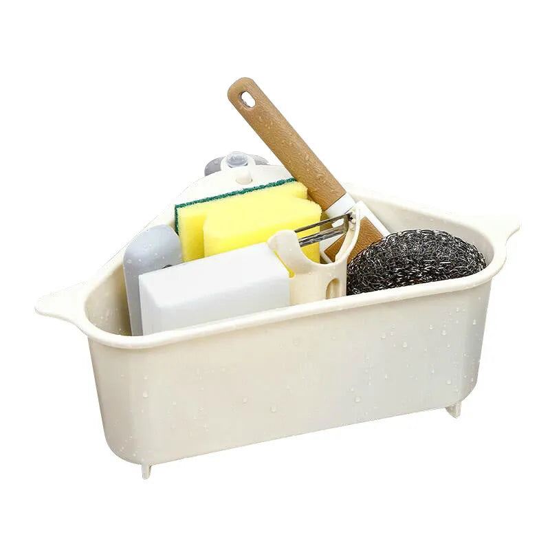 Beige plastic triangle sponge drain rack hanging from a kitchen faucet.