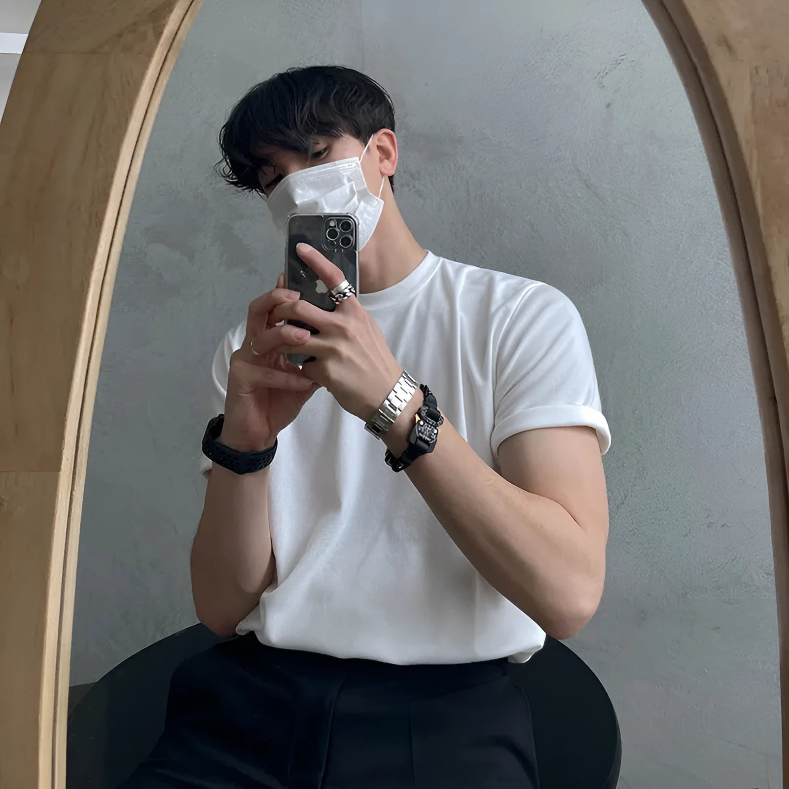 Slim fit men's cotton T-shirt in black on a white background, showing round neck and short sleeves.