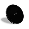 Ultra-thin square wireless charging pad in black showing smartphone charging on its surface