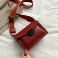 Vintage PU leather crossbody bag in black, shown with a mobile phone and wallet inside