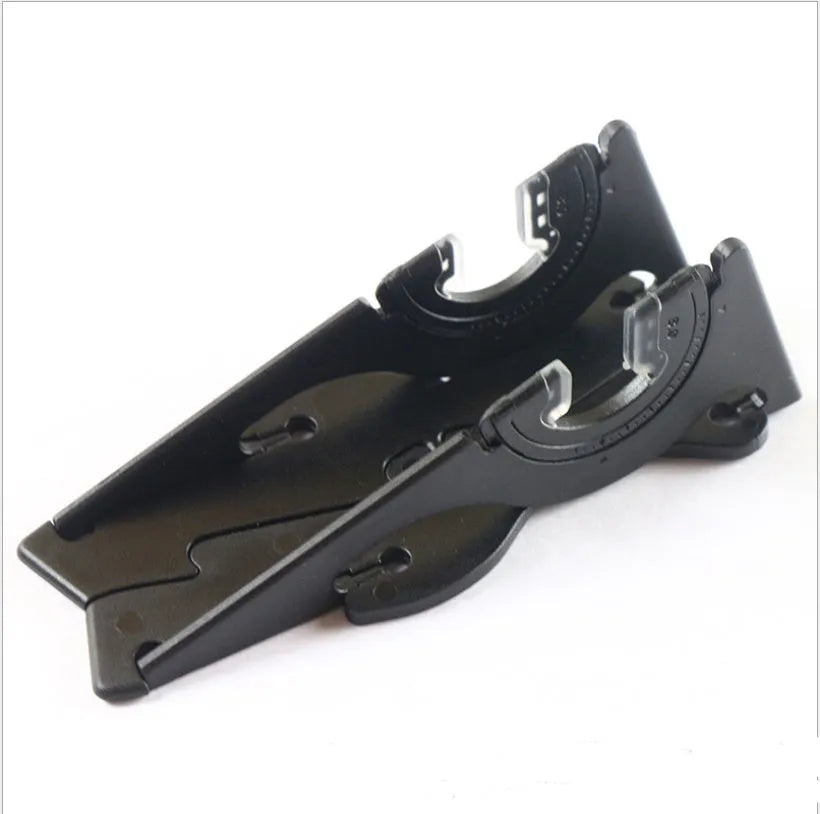 Black plastic card type mobile phone holder with adjustable lazy bracket on desktop