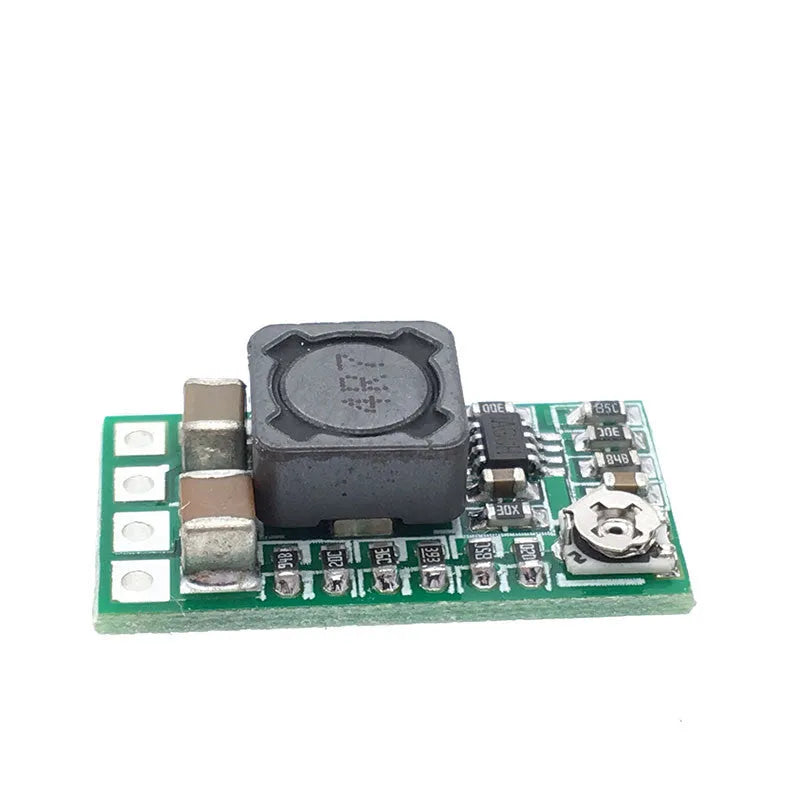 Green mini DC-DC step down power module converting 12-24V to 5V 3A output.