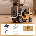 Mini alloy remote control forklift model with cargo pallet and hook on a table.