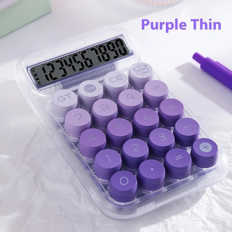 Round keypad gradient colour calculator in blue, green, pink, or purple on a desk.