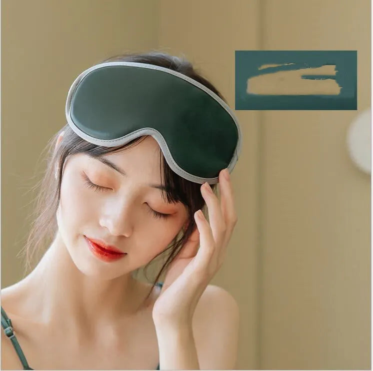 Portable eye spa massage goggles with suede exterior showing heat and vibration controls