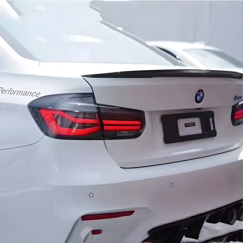 BMW 3 Series E90 aftermarket LED tail light assembly in red and smoked black finish.