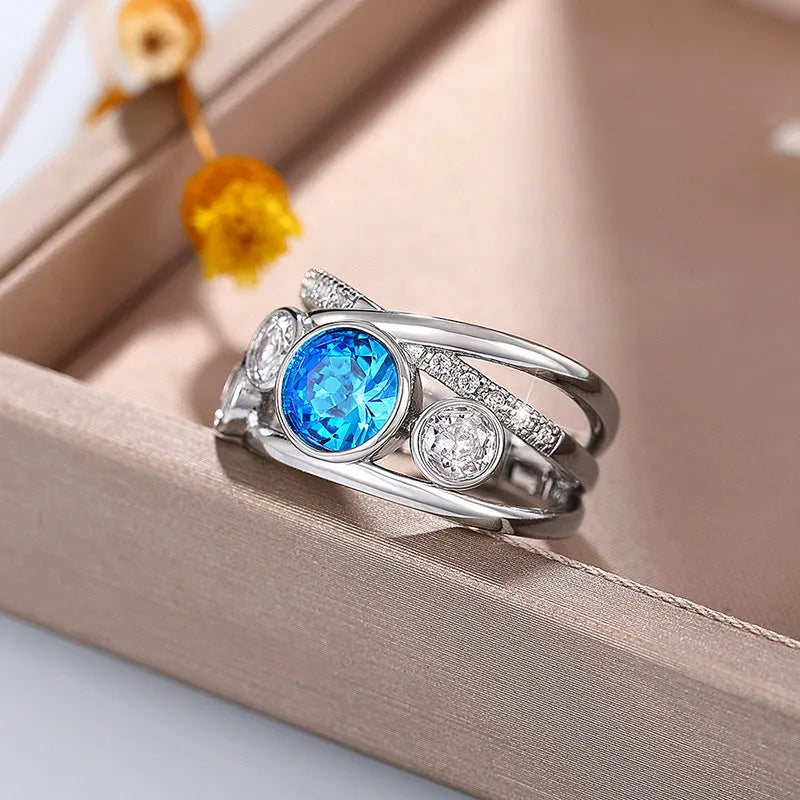 Retro hollow inlaid round copper ring in white gold colour with zircon stones