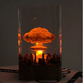 Small resin atomic bomb mushroom cloud night lamp ornament on a desk.