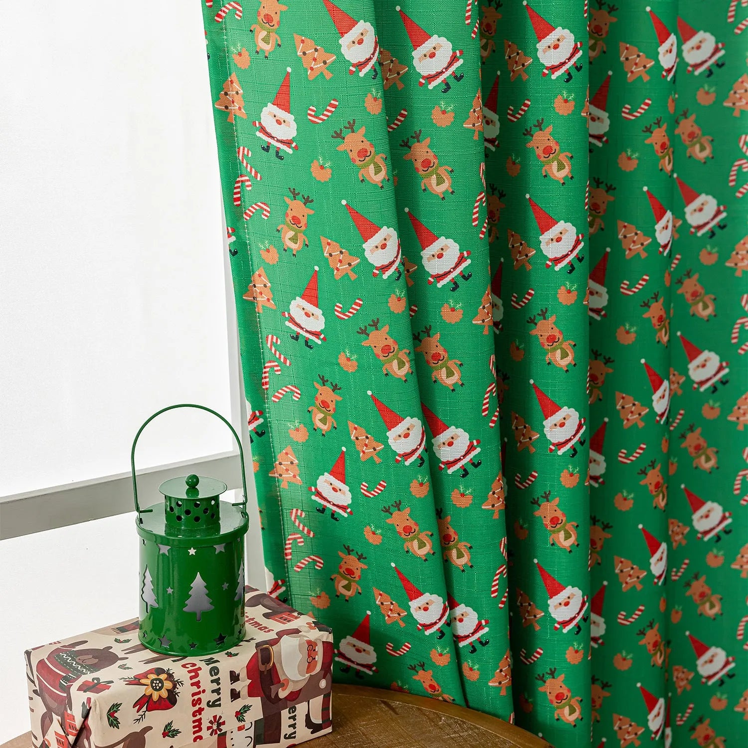 Christmas curtain with snowman and angel cartoon print in green colour, 1 metre length