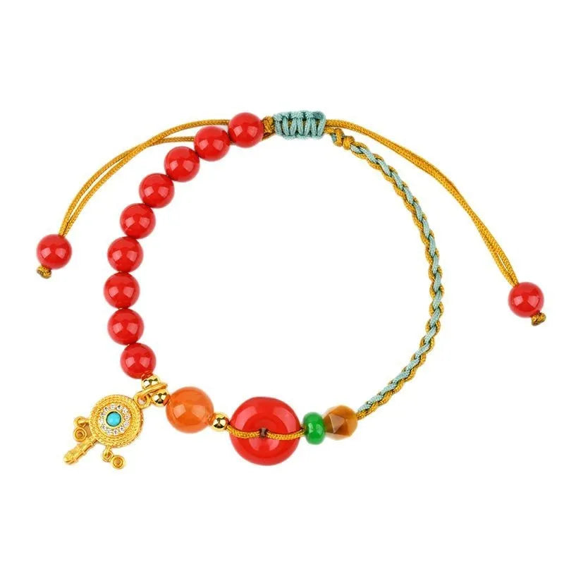 Hand-woven cinnabar peace buckle bracelet in emperor red sand colour with geometric pattern