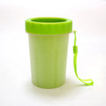 Dog paw cleaner with soft silicone bristles, BPA free, flat bottle mouth, in pink, blue or green, sizes S and L.